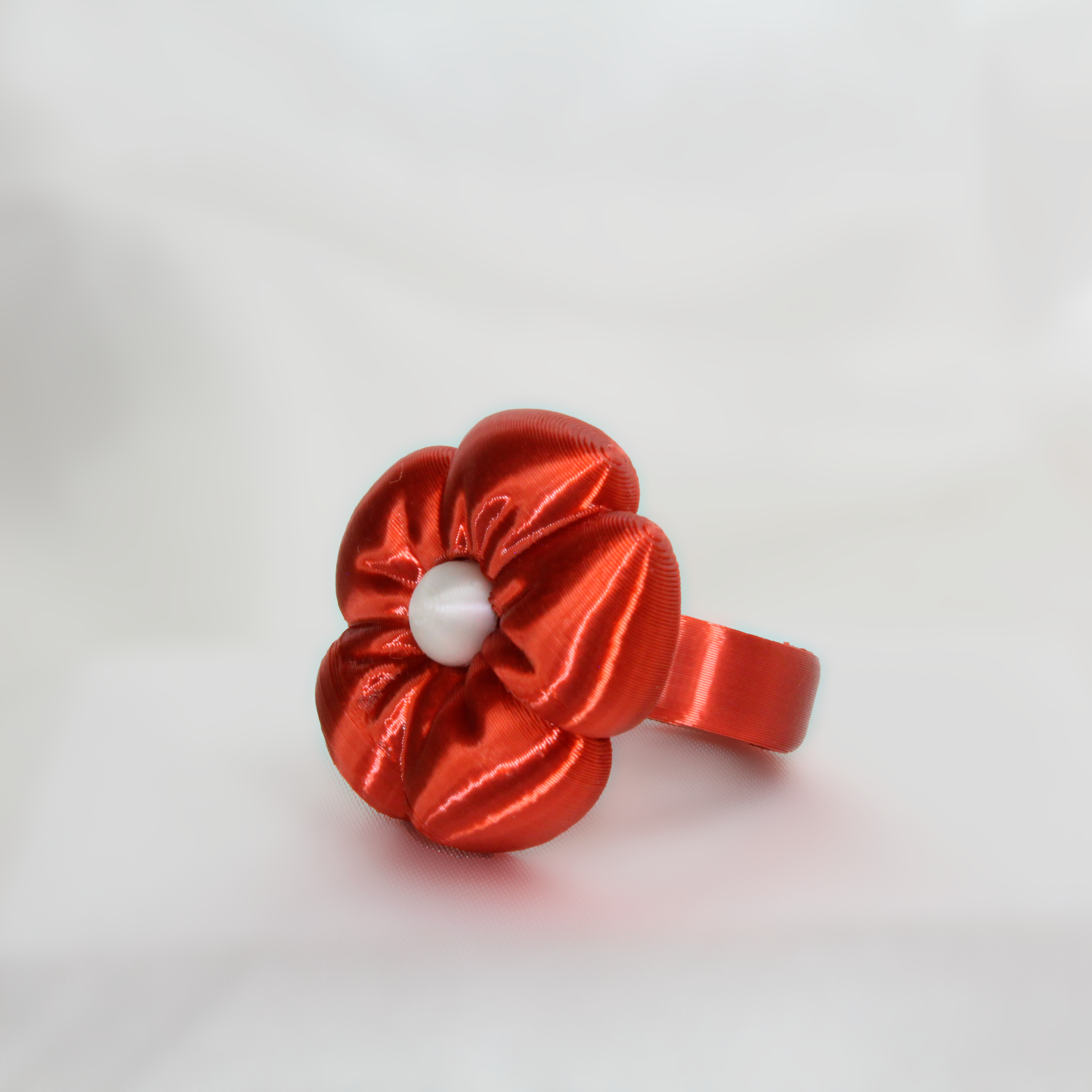 Red scrunchie on a white background
